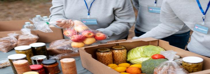 Customers of the New York Common Pantry receive toiletry donations from Amazon and L'Oreal